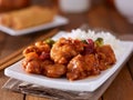 Plate of chinese general tsos chicken with rice and broccoli Royalty Free Stock Photo