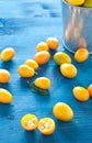 Plate of Chinese mandarins on wooden background