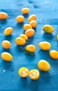 Plate of Chinese mandarins on wooden background