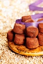 Plate of chocolate confectionery with ribbon