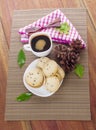 Plate with chocolate cookies and cup of hot coffee on old wooden table. Top view Royalty Free Stock Photo