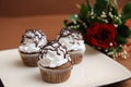 Plate with chocolate cupcakes with cream Royalty Free Stock Photo