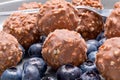 A plate of chocolate nut clusters with blueberries Royalty Free Stock Photo