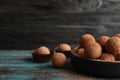 Plate of chocolate truffles on table, space for text Royalty Free Stock Photo
