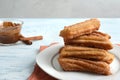 Plate of churros with chocolate dipping sauce