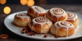 a plate of cinnamon rolls with glaze on top. Royalty Free Stock Photo
