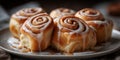 a plate of cinnamon rolls with glaze on top. Royalty Free Stock Photo