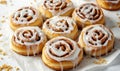 A plate of cinnamon rolls with a glaze on top Royalty Free Stock Photo