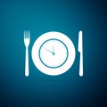 Plate with clock, fork and knife icon isolated on blue background. Lunch time. Eating, nutrition regime, meal time and Royalty Free Stock Photo