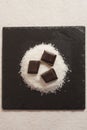Plate of coconut powder and pieces of chocolate
