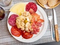 Plate with coldcuts and russain salad, Spanish entremets Royalty Free Stock Photo