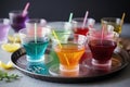 plate of colorful cocktails with straws and umbrellas for summer party Royalty Free Stock Photo