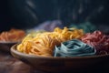 a plate of colorful pasta noodles on a wooden table top