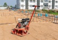 The Plate compactor at a construction site Royalty Free Stock Photo