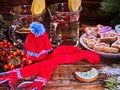 Plate cookies and glasses mug . Hat with scarf symbol winter. Royalty Free Stock Photo