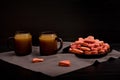 A plate of cookies with red heart-shaped, mugs of coffee with milk, Valentine's Day