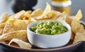 Plate of corn tortilla chips with guacamole dip Royalty Free Stock Photo