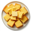 A plate of cornbread slices with butter, isolated on a white Royalty Free Stock Photo