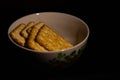A plate of crackers on a dark background Royalty Free Stock Photo