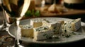 A plate of creamy blue cheese is paired with a sweet dessert wine creating a delectable contrast of flavors
