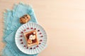 Plate with creative sweet toast and cookies on wooden table