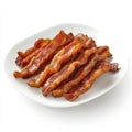 A plate of crispy bacon strips, isolated on a white background, Royalty Free Stock Photo