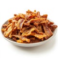 A plate of crispy bacon strips, isolated on a white background, Royalty Free Stock Photo