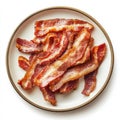 A plate of crispy bacon strips, isolated on a white background, Royalty Free Stock Photo