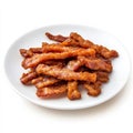 A plate of crispy bacon strips, isolated on a white background, Royalty Free Stock Photo