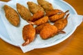 A plate of crispy and delicious fried butterfly prawns and fried cod sticks Royalty Free Stock Photo