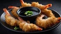 Delicious Crispy Fried Shrimp Tempura with Soy Sauce Dipping on Dark Plate Royalty Free Stock Photo