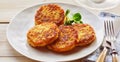 Plate of crispy golden fried potato fritters