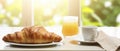 Plate of Croissants and Glass of Orange Juice for Breakfast on Wooden Table Royalty Free Stock Photo