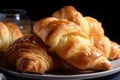 plate of croissants, warm and flaky on the inside and golden brown on the outside