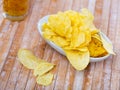 Potato chips served with glass of beer Royalty Free Stock Photo
