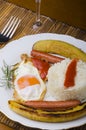 Plate with Cuban rice with bananas and tomato sauce Royalty Free Stock Photo