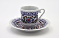 Plate and cup on a white background. Turkish coffee set. Side view. Close-up.