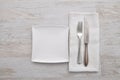 Plate, cutlery and cloth on wood Royalty Free Stock Photo