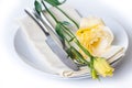 Plate, cutlery and yellow flower