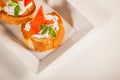 Plate of decorative salmon fish on bruschetta appetizer Royalty Free Stock Photo