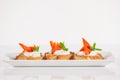 Plate of decorative salmon fish on bruschetta appetizer Royalty Free Stock Photo