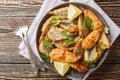 Plate of deep fried anchovies with lemon closeup. Horizontal top view Royalty Free Stock Photo