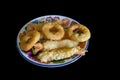 Plate of deep fried calamari and tempura prawns