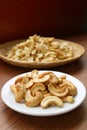 Plate of Roasted Cashew Nut with Blurry Dried Kernel in the Backdrop