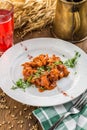 Plate of delicious authentic Hungarian goulash with berry drink on wooden table Royalty Free Stock Photo