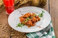 Plate of delicious authentic Hungarian goulash with berry drink on wooden table Royalty Free Stock Photo