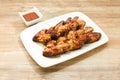Plate of delicious barbecue chicken wings Royalty Free Stock Photo