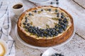 Plate with delicious blueberry cheesecake on white table Royalty Free Stock Photo