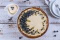 Plate with delicious blueberry cheesecake on white table Royalty Free Stock Photo