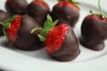 Plate with delicious chocolate covered strawberries Royalty Free Stock Photo